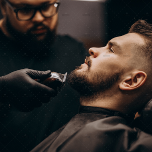 demo-attachment-871-handsome-man-cutting-beard-barber-salon